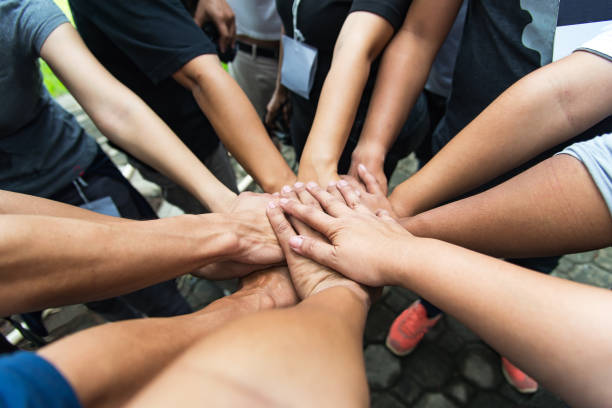 istock Group of people United Hands to built teamwork together with Spirit - teamwork concepts,teamwork 856152932