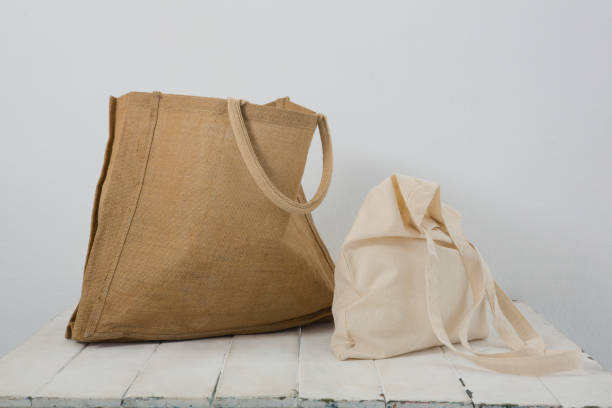 istock Brown and beige bags on table 856163104