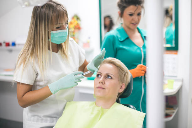 istock Young woman is getting a collage injection in her face. 856163402