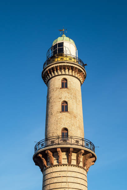 istock The lighthouse on the beach in Warnemuende, Germany 856163432