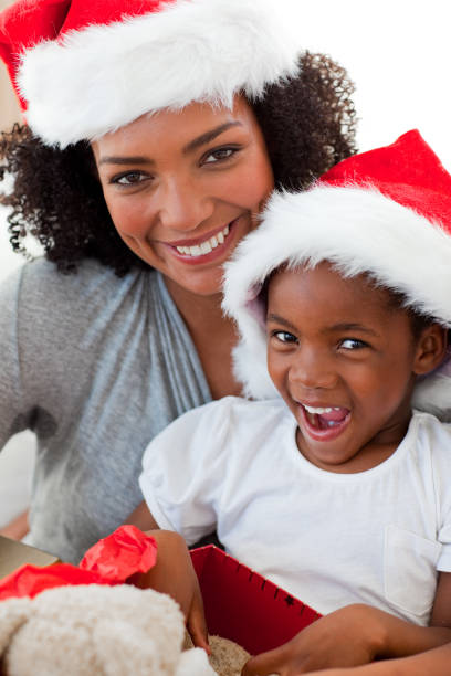 istock Mother and daughter having fun at Christmas time 856163642