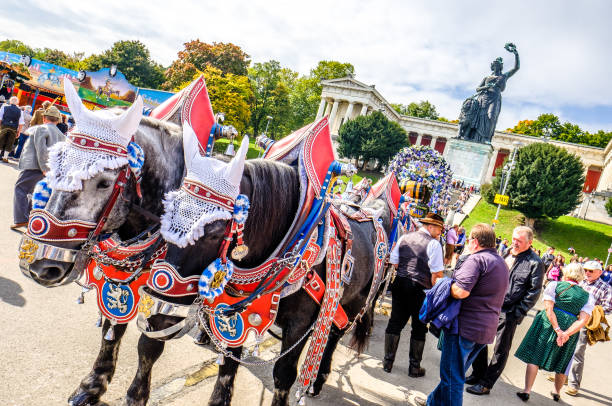 Munich, Germany - September 27, 2017: people and fairground rides at the biggest folk festival in the world - the octoberfest on september 27, 2017 in munich. Since 1810 it takes place on the Theresienwiese in the Bavarian state capital Munich.