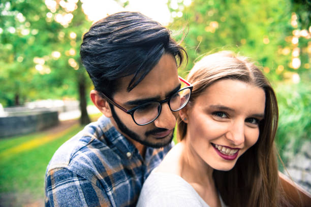 istock Smiling couple in the city park 856170690