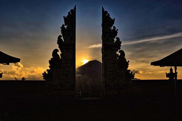 Gunung Agung from within the Lempuyang temple grounds at sunset. Temple 'kori' gate in foreground with volcano behind to the west.