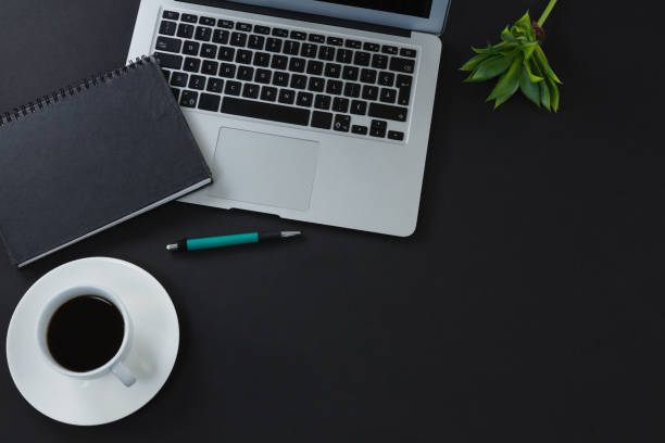 istock Black coffee, pen, organizer and laptop on black background 856171516