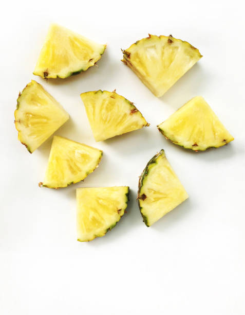 istock slices of pineapple isolated on white background 856172626