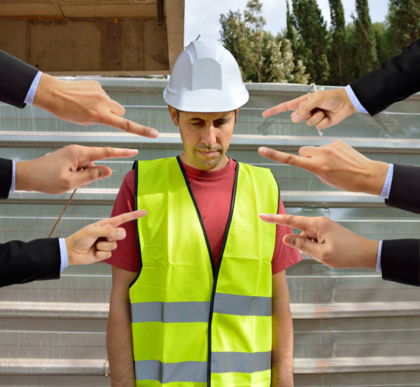 many hands pointing the bullying a workman that is suffering  mobbing on concept of accusation guilty shy,and in concept of dismissal from work