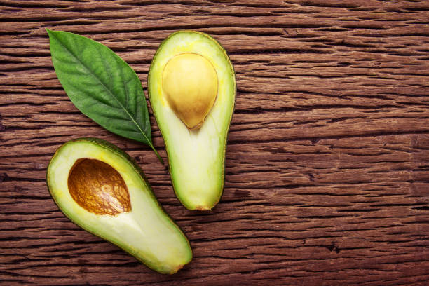 istock Avocado on a brown wood background. 856177354