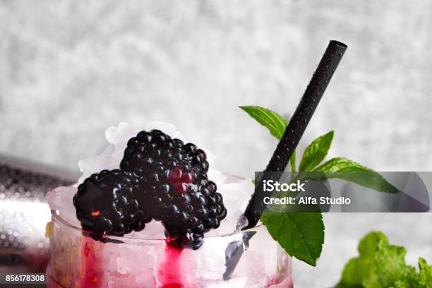 Closeup Of A Refreshing Drink With Mint Twig And Blackberries A Cocktail On A Gray Background Healthy Berries And Mint Stock Photo - Download Image Now