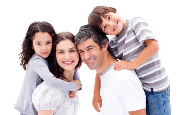 istock Smiling parents giving their children a piggyback ride 856178394
