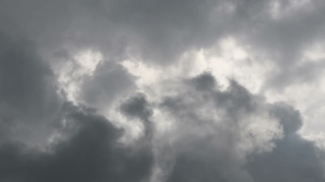 Close-up view of a background of clouds drifting across the sky during the day, slowly.