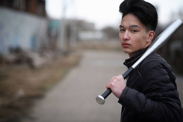istock Asian young man on the street posing at the camera 856185438