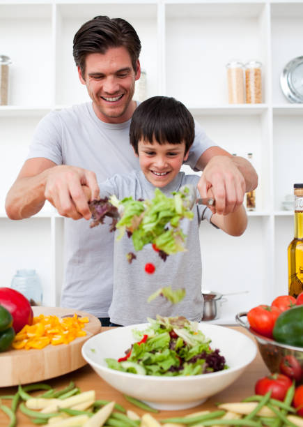 istock Little boy and his father cooking 856185722