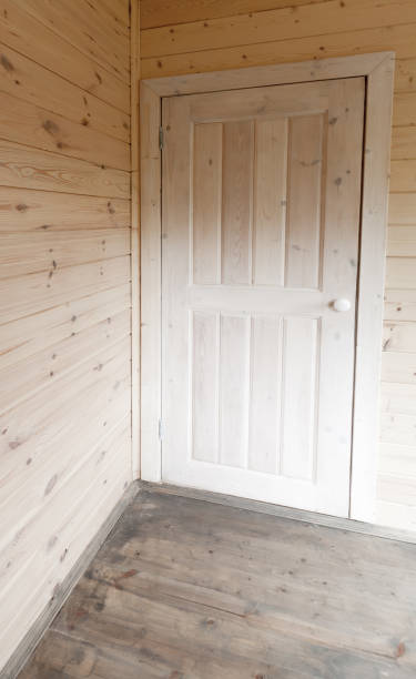 istock Wooden interior. White door in the corner 856188782