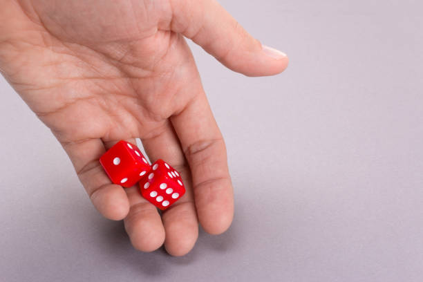 istock Dice red in the hands of a man 856188900