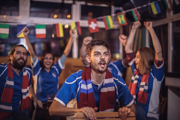 istock Friends watching football match in bar 856188946