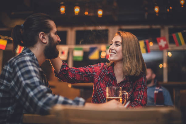 istock Young couple sitting in a bar 856189610