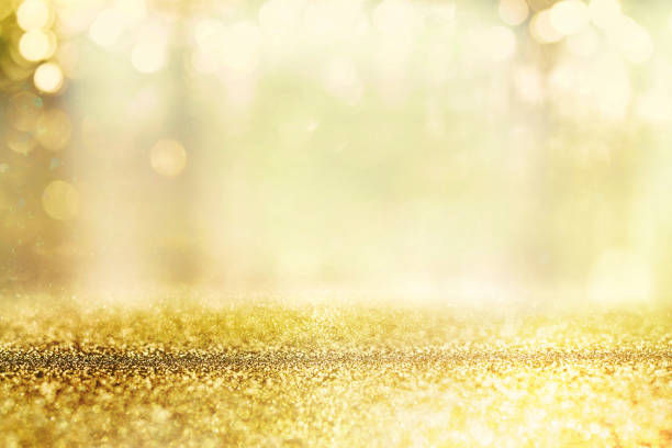istock glitter vintage lights background. silver, gold and white. de-focused. 856196856