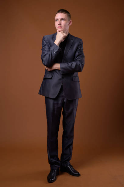 istock Studio shot of young businessman wearing suit against colored background 856196884