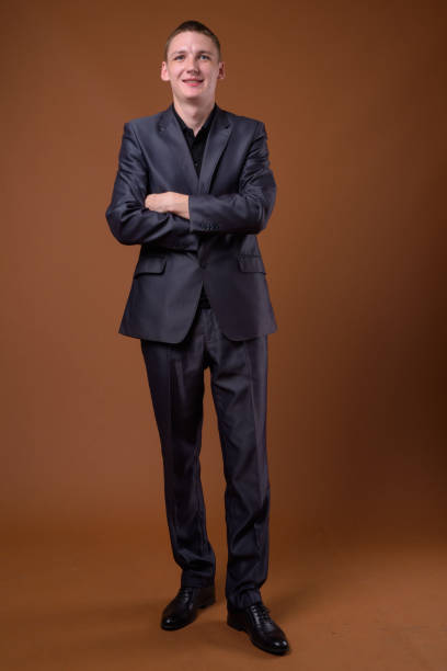 istock Studio shot of young businessman wearing suit against colored background 856196976