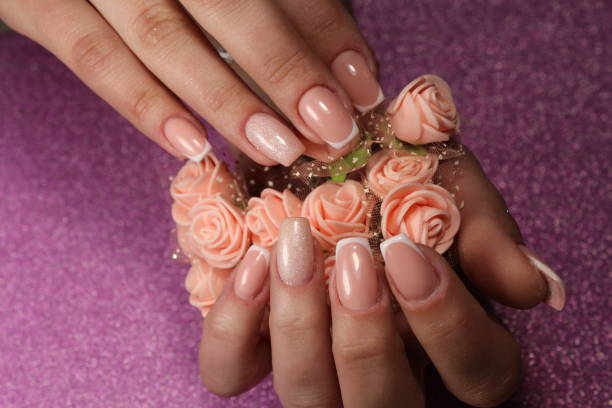 istock French manicure design with flowers 856207820