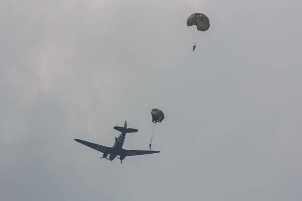 World War 2 era soldiers landing on a field