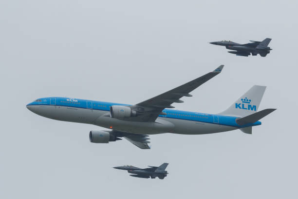 Leeuwarden Netherlands June 11 2016: Airbus A330 of the KLM escorted by two F-16 of the Royal Dutch Airforce Leeuwarden Netherlands June 11 2016: Airbus A330 of the KLM escorted by two F-16 of the Royal Dutch Airforce intercepting stock pictures, royalty-free photos & images