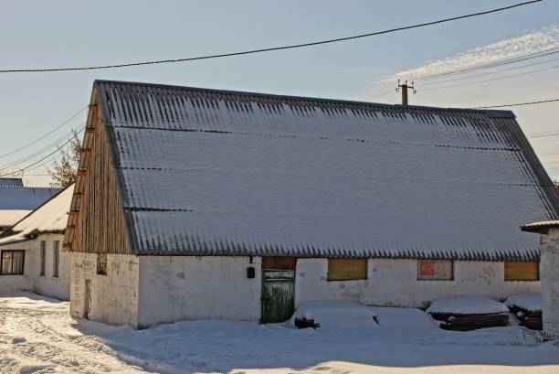 istock An old building with a roof vile snow 856214968