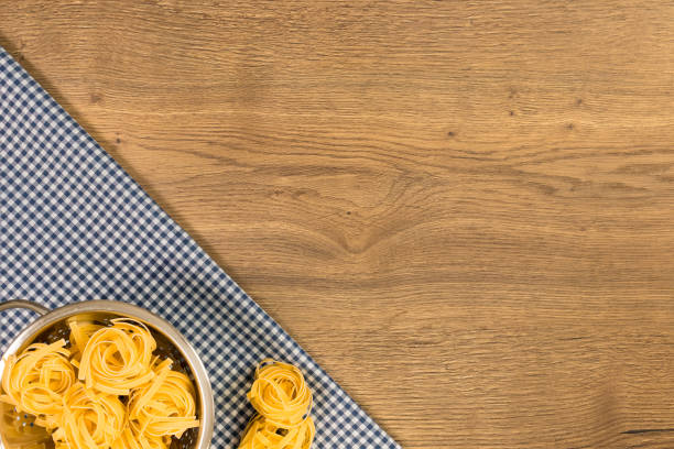 Italian food and raw ingredients on wooden background.