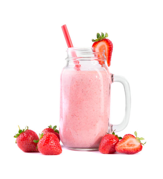 istock A smoothie cocktail in a mason jar. A pink strawberry drink. Fruit beverage and fresh berries isolated on a white background. 856216082