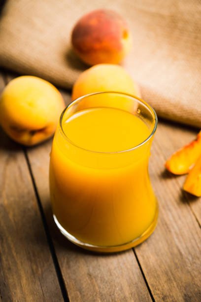istock Jar of peach iced tea with fresh peaches on the rustic background 856226398