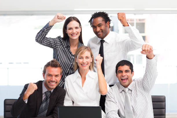istock Happy business team celebrating a success in office 856229308