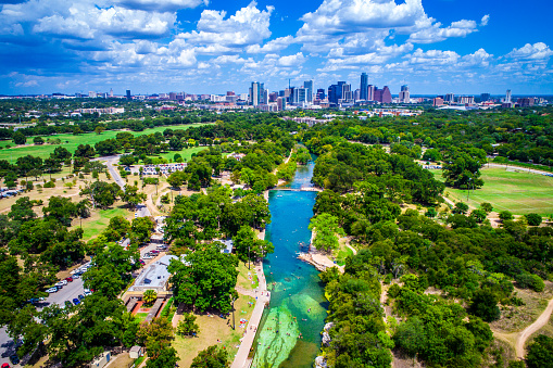 Barton Springs Paradise in the Capital City of Austin Texas a summer time view of the Hill Country with clear paradise water flowing down Barton Creek