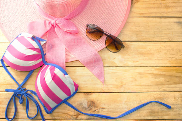 bikini - glasses - hat - on wood, colorful summer season bikini - glasses - hat - on wood, colorful summer season catwalk fashion show fashion swimwear stock pictures, royalty-free photos & images