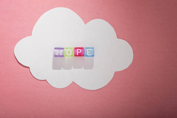 istock Colorful alphabet beads and white paper cloud 856234204