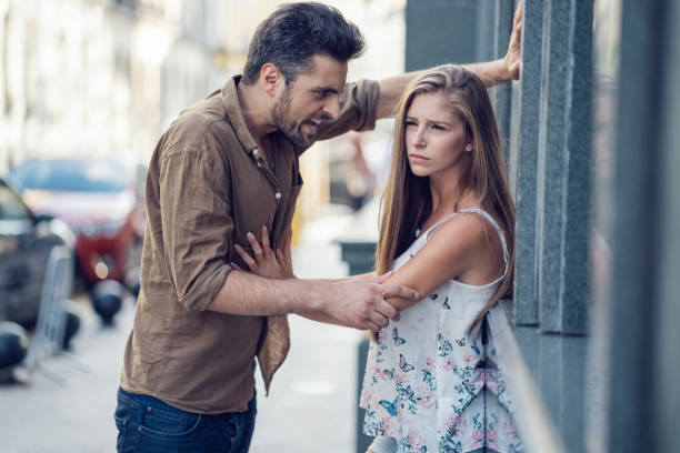 istock Man shouting with anger at his spouse on the street 856234866