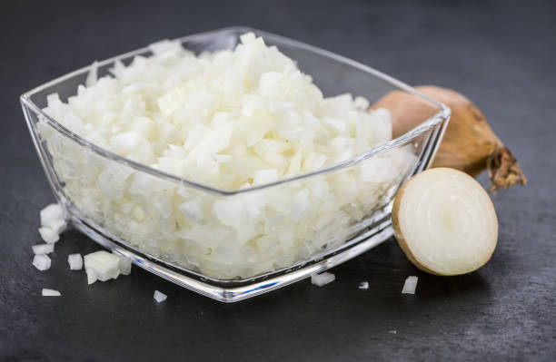 istock Some Chopped white onions on a dark slate slab 856240798