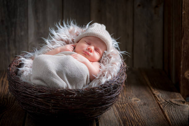 istock Adorable newborn infant sleeping on the blanket 856242116