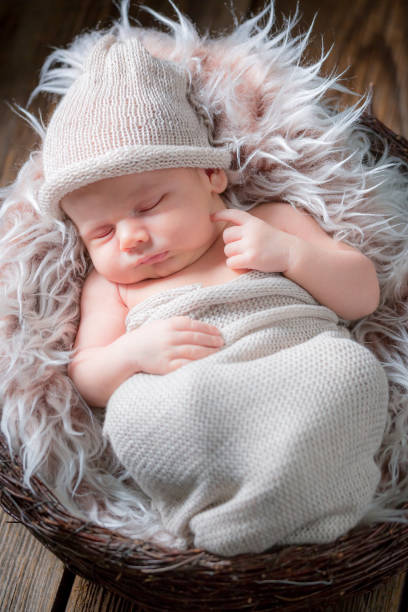 istock Adorable newborn baby sleeping on the blanket 856242234