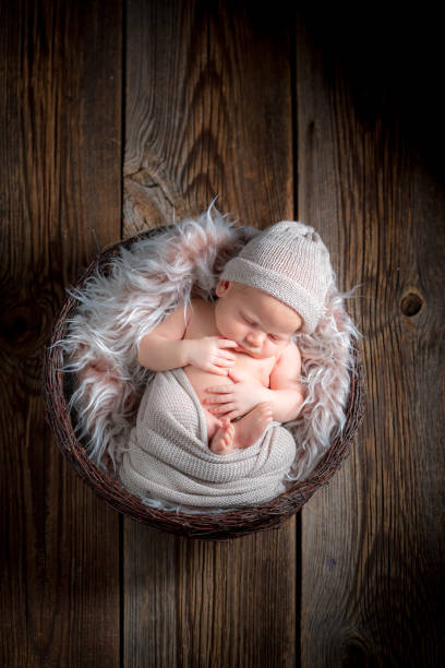 istock Cute newborn baby sleeping on a fluffy blanket 856243098