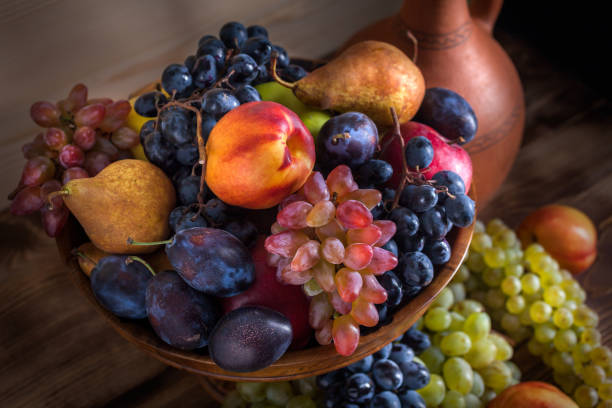 istock autumnal fruit still life with Georgian jug on rustic wooden table background 856252862