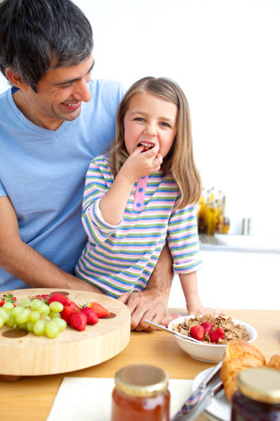 istock Jolly father and his daughter having breakfast 856263240