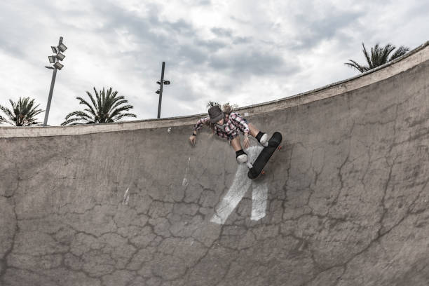 istock Young woman skating in skateboard park 856270060