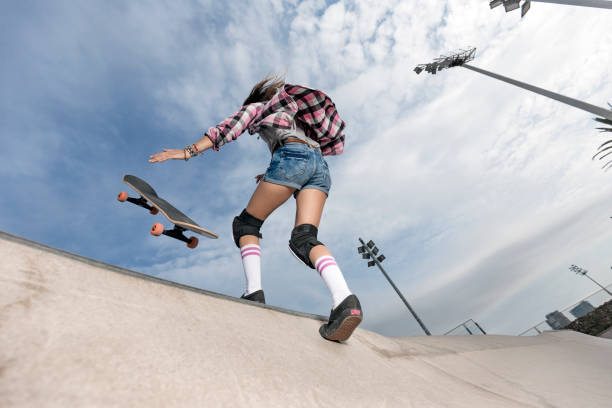 istock Young woman skating in skateboard park 856270078