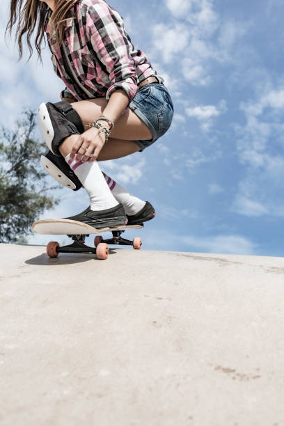 istock Young woman skating in skateboard park 856270128