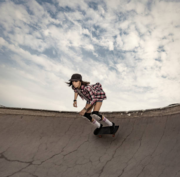 istock Woman skateboarding in skateboard park 856270156