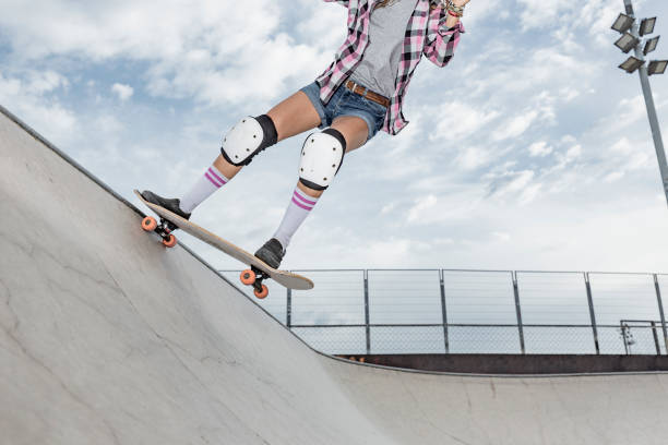 istock Young woman skating in skateboard park 856270188