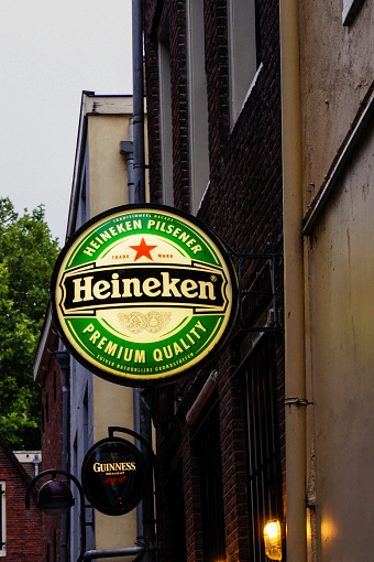 Heineken logo hang on the wall building in Amsterdam. July 2017 Amsterdam NL