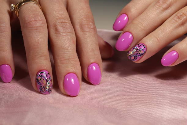 istock Pink manicure design with butterfly and rhinestones 856279654