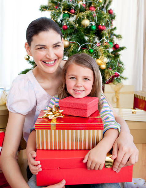 istock Mother and daughter at home at Christmas time 856282974